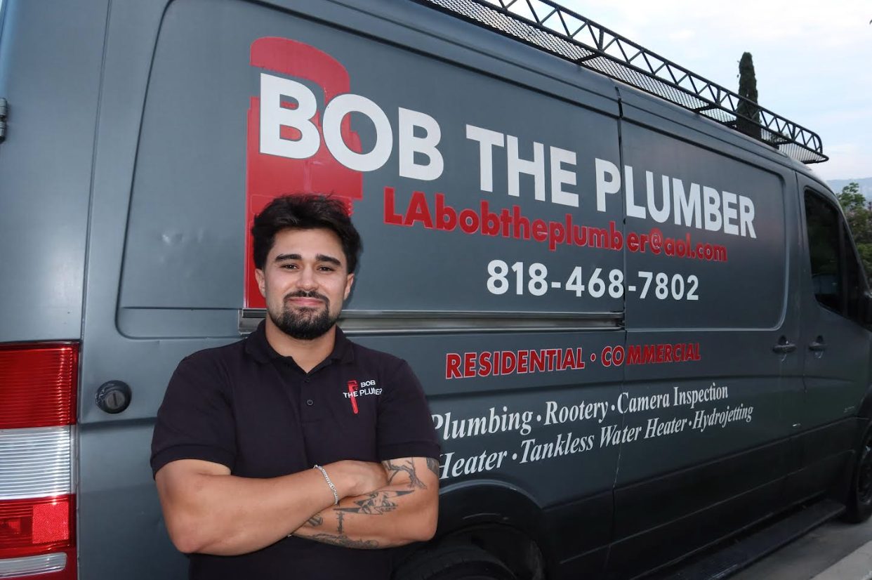 Jeremy, co-owner of Bob The Plumber, in front of the service van